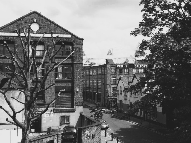 Narrowboats and Victorian warehouses on the canal at Fish Island